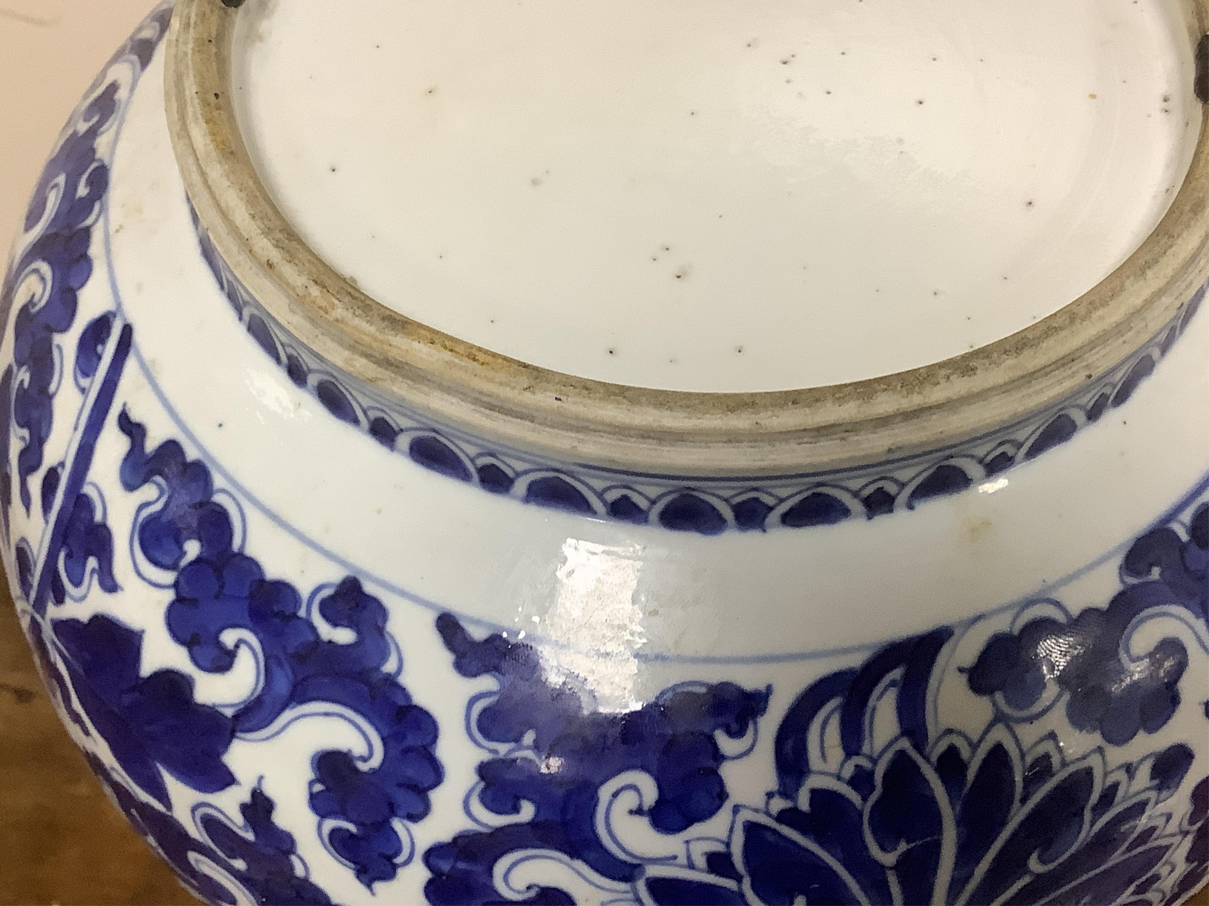 A Chinese blue and white bottle vase with lotus decoration, restored, Kangxi Period, 44cm high